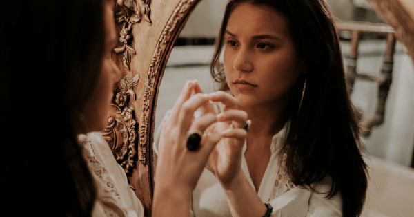 Girl looking in the mirror